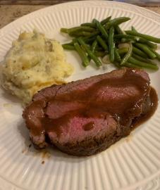 Plated Beef Tenderloin with Herbed Smashed Potaotes and Almond Green Beans